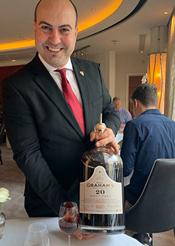 Antonio.Palmarini with a bottle of wine
